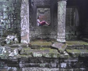 Senior Grace Leathrum takes a moment to reflect at the historic temple complex of Angkor Wat. Photo by Max Foldeak