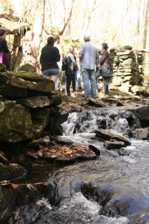 A field trip for The Presence of the Past explores local history along Pond Brook, near the former site of Mather’s Mills.