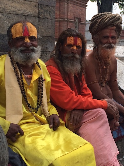Shaivites, or devotees of Shiva, pass the time near Pashupatinath, one of the most sacred Hindu temples in Nepal. Photo by Lynette Rummel