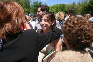 Lucy joins in the massive hug-fest following commencement. Photo by Dianna Noyes