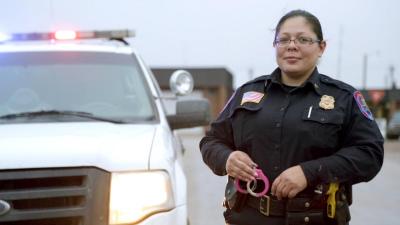 Demonstratively dubbed “RoboCop,” Sergeant Dawn White famously sports a pair of pink handcuffs, and has even pulled over her own mother for a missing taillight.
