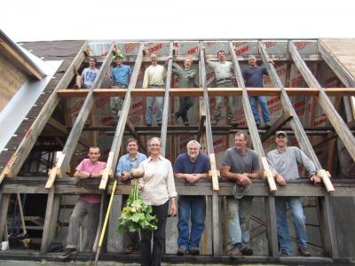 Ellen celebrates the construction of the community greenhouse on Work Day in 2012.