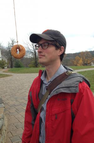 Writing professor Kyhl Lyndgaard ponders the literary significance of a hanging cider donut on Apple Days. 