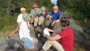 Former staff Sally Andrews and Peter Cooper celebrated hiking the whole Long Trail together (over several summers) by enjoying some bubbly with friends at the Canadian border.