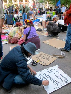 Protestors make signs during the Occupy Wall Street demonstration in 2011. Photo by Caleb Clark