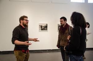 Visiting photography professor Marcus Desieno ’10 discusses landscape, place, and power with Sterling Trail ’17 and Forest Pride ’16, during his exhibition in February titled Surveillance Landscapes.
