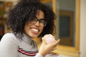 Karla-Julia Ramos ’20 enjoys her self-designed cookie during “Consent and Cookies.” Photo by Emily Weatherill ’21 