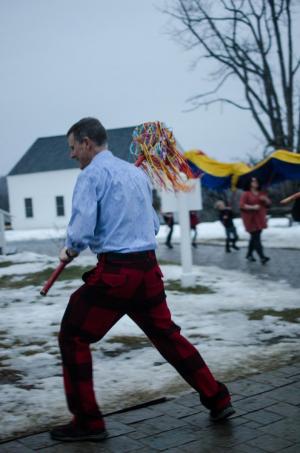 Asian studies professor Seth Hart braves a cold rain to celebrate the Lunar New Year in February. Photo by Clayton Clemetson ’19 