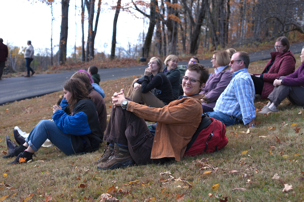 Felix Bieneman ’20 and other community members relax on library hill before community photo last fall. Students have received extensive support in navigating their transition. Photo by Emily Weatherill ’21