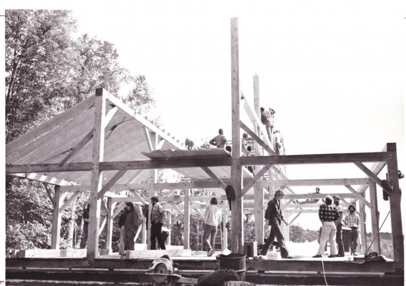 Community members work together to help raise the Campus Center in 1981.