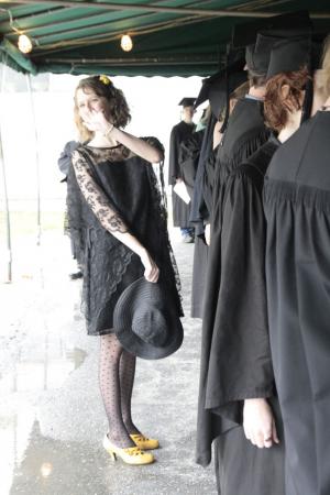 Elizabeth Hill '11 waves before joining the procession into commencement. Photo by Thea Cabreros