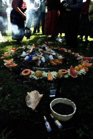 Members of the Association for Justice and Reconciliation participate in a ceremony in memory of loved ones lost. Photo by Graham Charles Hunt