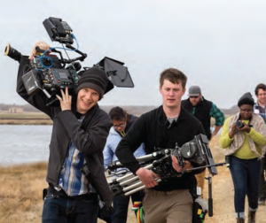 Brad Heck ‘04 and Luke Becker-Lowe ’17 head to the beach with other Movies from Marlboro participants for a shoot on location in Nantucket. Photo by Willow O’Feral 