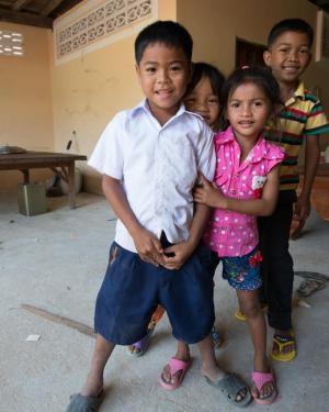 Students take time out from their studies to greet visitors from Marlboro last winter, during the third service-learning trip to Cambodia in the past five years. Photo by John Willis