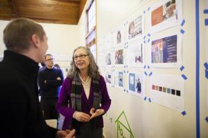 Ellen converses with staff from kor group during the “creative collection” leading up to the recent changes in admissions materials and website. Photo by Devlo Media 