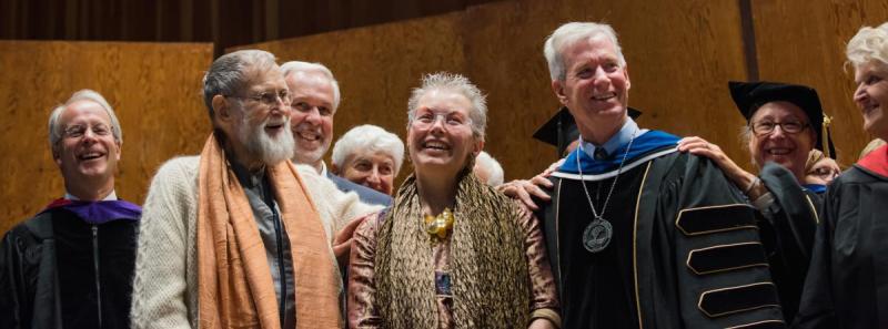 The ceremony was concluded by Jim Levinson, local friend, outside evaluator, and father of Noah Levinson ’05, who asked past presidents and other honored guests to lay their hands on President Kevin and Susan for a benediction.