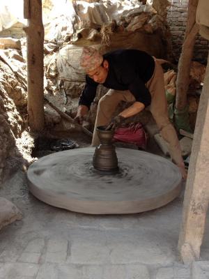 A potter in Pottery Square, Bhaktapur, brings forth new forms from the earth’s clay. Photo by Blake Stanyon '17