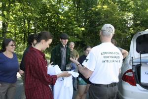 Kevin hands out T-shirts emblazoned with “Looking for a few rugged intellectuals,” to students participating in the Day of Connection and Service that kicked off his inaugural weekend.