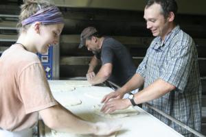 Randy lends a hand making pizzaz, Red Hen’s prebaked pizza crusts.