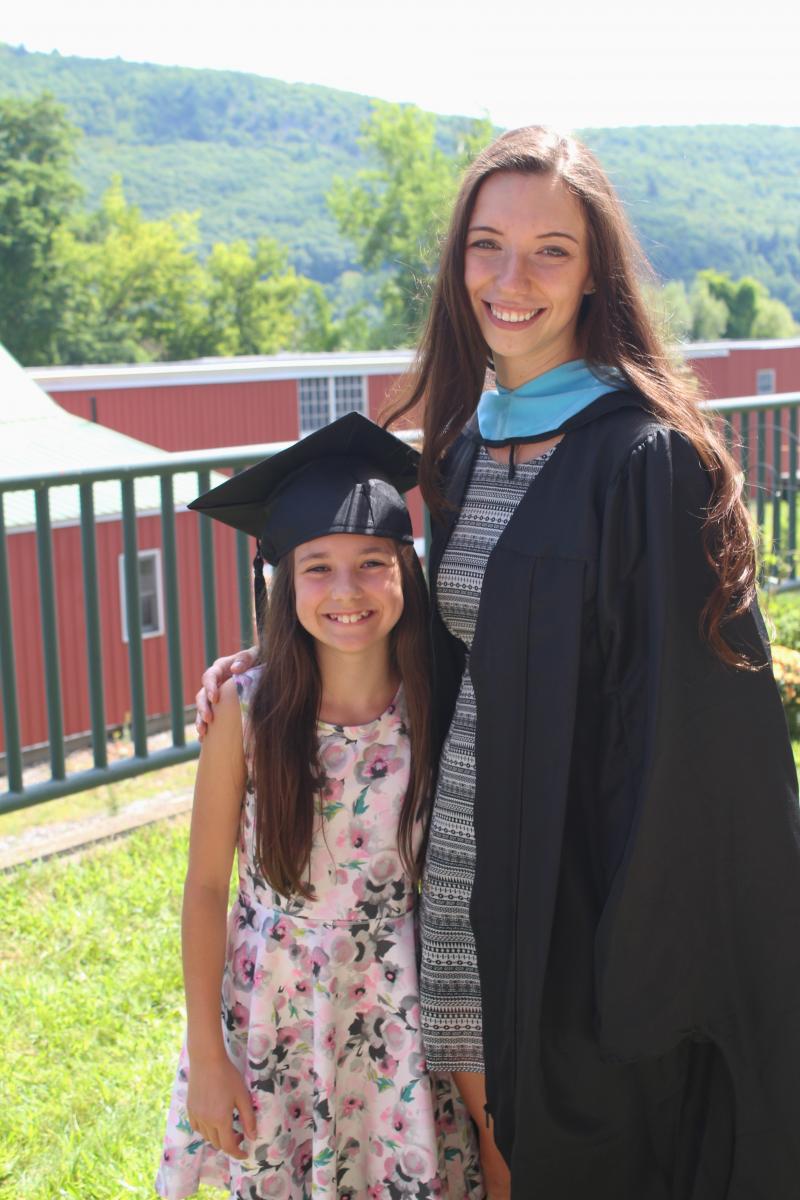 MA-TESOL graduate Jamie Polzin celebrates with a young family member. Photos by Diane Heileman