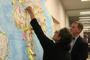 Nelli flags Armenia on a world map during one of the international events for President Kevin's inauguration.