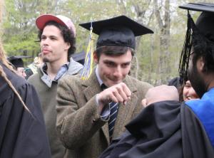 Edward Suprenant ’16 gets a fist bump from religion professor Amer Latif.