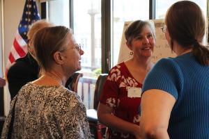 Politics professor Meg Mott talks to alumni and prospective families after presenting “The Return of Machiavellian Politics” in May at the National Press Club, Washington, D.C., the latest in a series of Marlboro on the Road events. Photo by Elisabeth Joffe ’14 