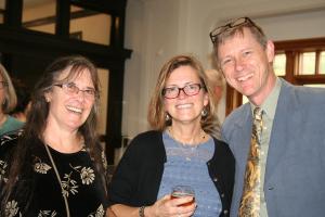 Jenny Ramstetter (biology), Kate Ratcliff (American studies) and Seth Harter, (Asian studies) share a toast to the graduating class during senior dinner in May.