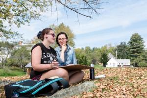 Freshman Emma Sheerin discusses her drawing with Amy Beecher. Photo by Kelly Fletcher