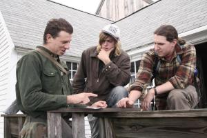 Ashley Bies '05, Peter Pugh '16, and Adam Katrick '06 discuss trails before heading out to maintain them.