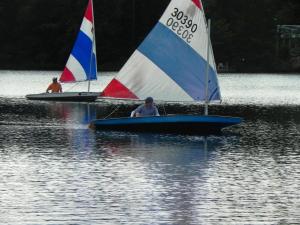 Visual arts professor Tim Segar gets the edge on Potash Hill editor Philip Johansson during a “Riff Raff Regatta” sunfish race on South Pond last August, organized by Mark Littlehales FS82. Tim won the “golden sunfish,” but did not gloat, reportedly. Photo by Suzy Deffeyes