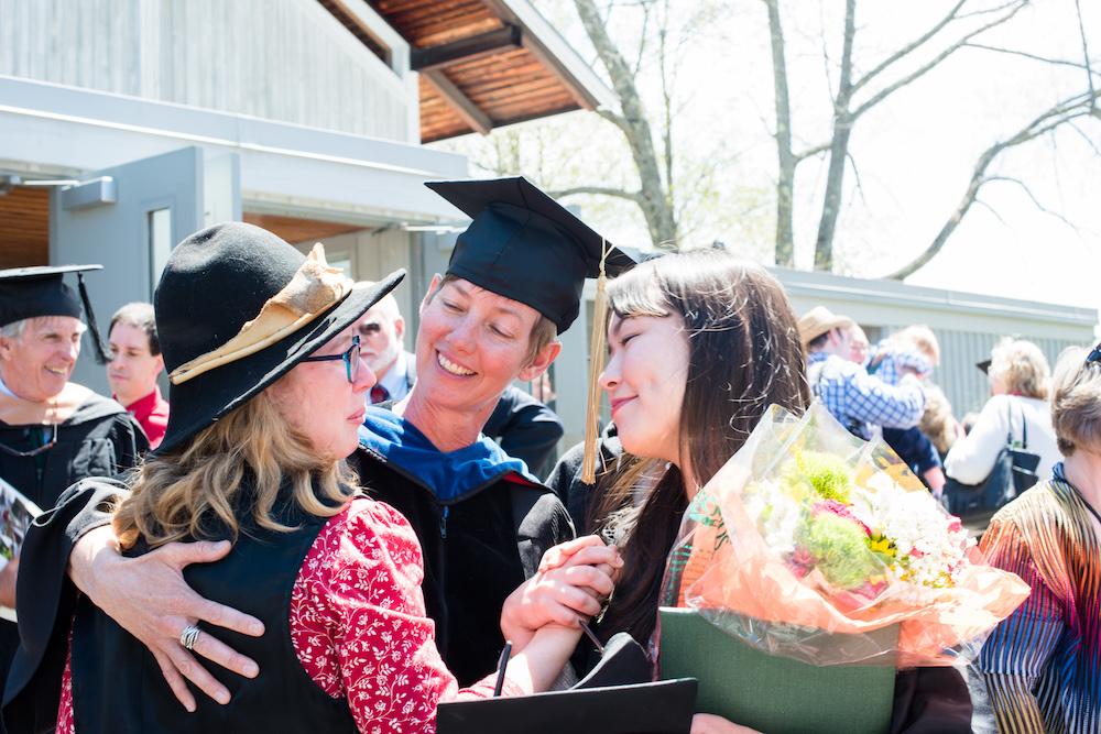 Erin Huang-Shaffer ’18 celebrates with theater professor Jean O'Hara and friend Allison Power.