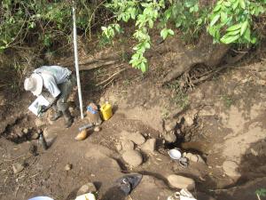 A field officer in Ethiopia measures the volume of a well for larvaecide application.