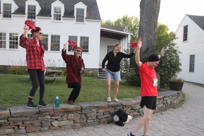 Brian Mooney ’90 warms up before running in the New England Green River Marathon in August, encouraged by his local cheering squad, featuring Vaune Trachtman ’89 (right). Andrew Clarke ’84 also participated in the run, which went from Marlboro College along the Green River to Greenfield. 