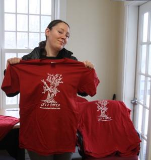 Krystal Graybeal models a T-shirt to commemorate the shredding of documents.